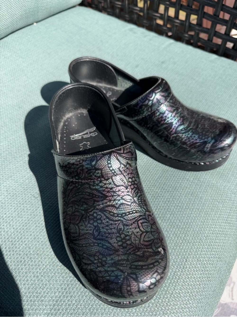 Dansko Black Clogs with Iridescent Purple-Green Accent